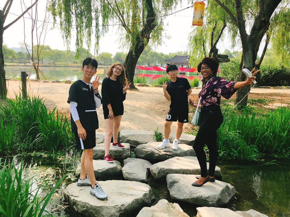 Students standing on rocks, participating in UGA Internships